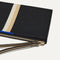 A closeup of The Wallet Wristlet in Black Portobello Stripe, focusing on the wrist strap.