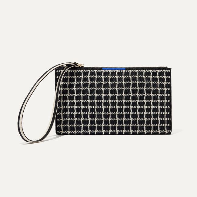 The Wallet Wristlet in Black and Ivory Grid, shown from the front.