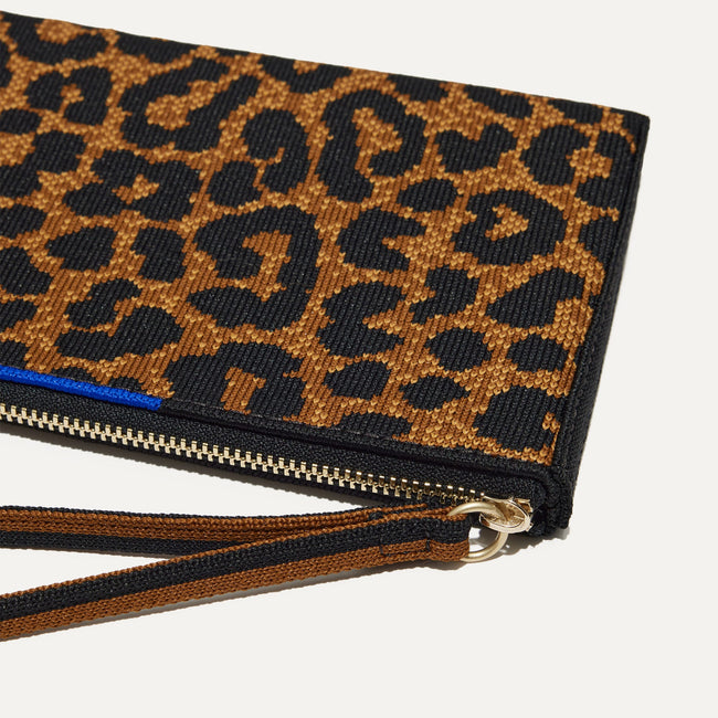 A closeup of The Wallet Wristlet in Classic Leopard, focusing on the wrist strap.