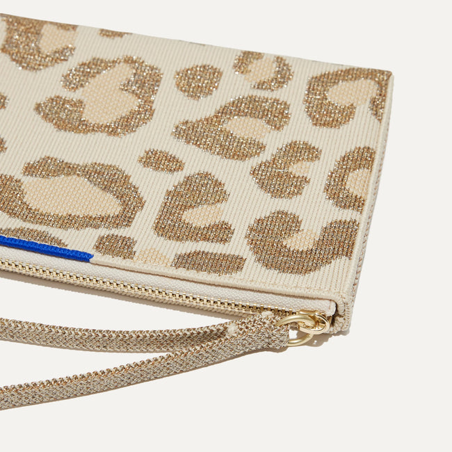 A closeup of The Wallet Wristlet in Shimmer Cat, focusing on the wrist strap.