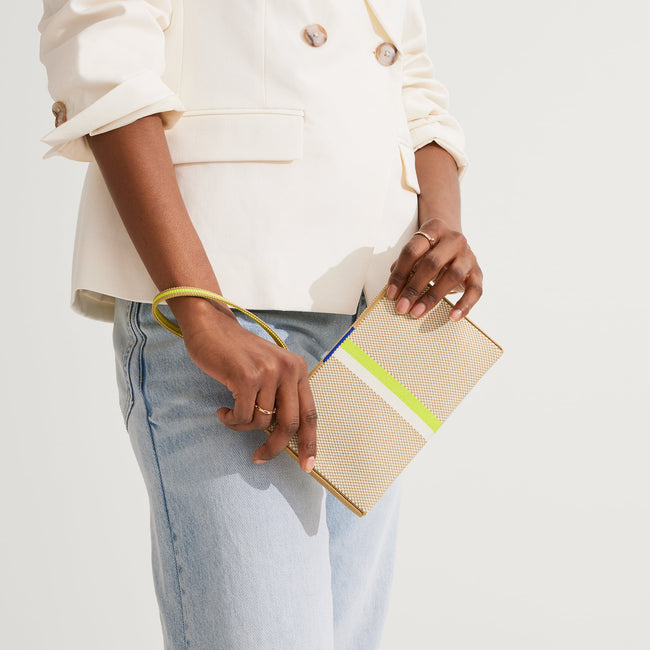 The Wallet Wristlet in Spring Colorblock, held by a model at an angle, shown from the front.