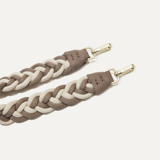 A close-up of The Braided Shoulder Strap in Cream & Cocoa, focusing on the end snap hooks. 
