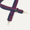 A close-up of The Crossbody Strap in Dark Aubergine, focusing on the end snap hooks and sliding buckle.