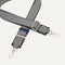 A close-up of The Crossbody Strap in Salt and Pepper, focusing on the end snap hooks and sliding buckle.
