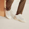 hover | Model wearing The High Top Sneaker in Sand Dune.