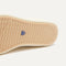 Outsole of The High Top Sneaker in Sand Dune shown from below, in diagonal view. 
