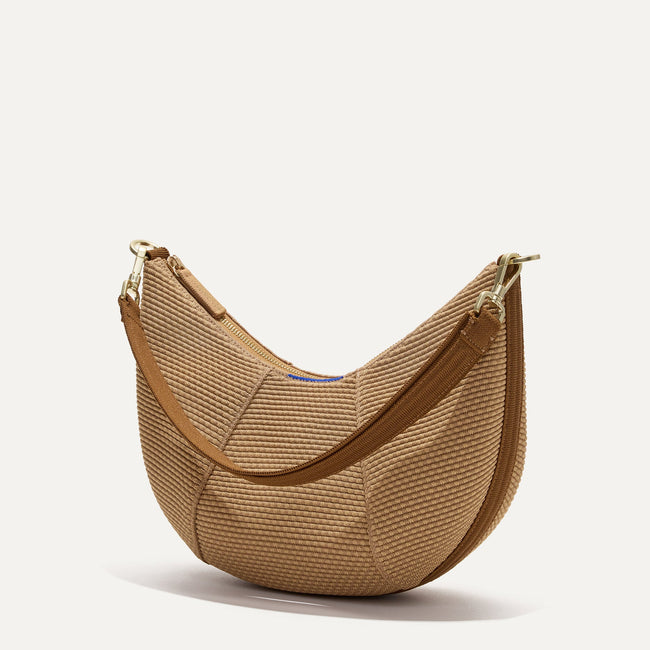 The Crescent Bag in Horizon, shown from the side.