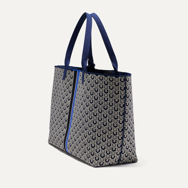 The Lightweight Mega Tote in Signature Blue, shown from the side.