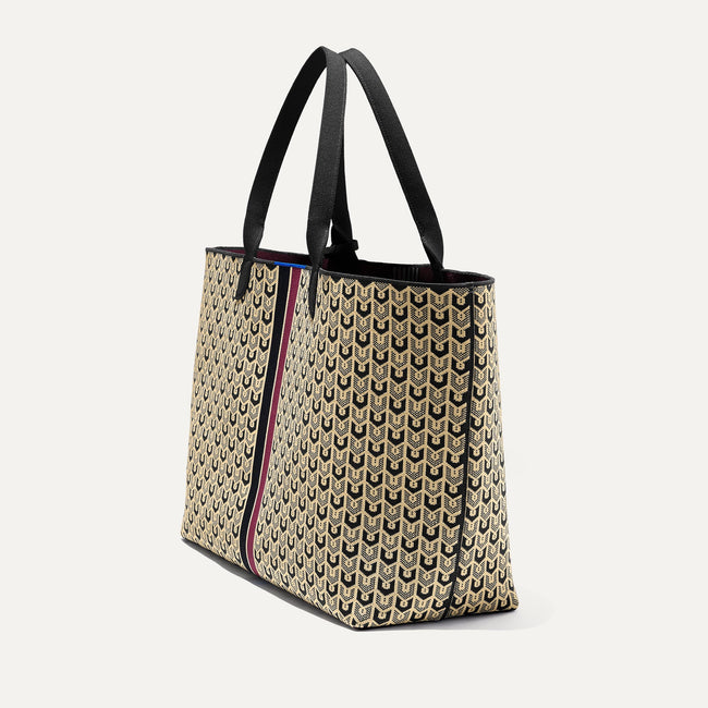 The Lightweight Mega Tote in Signature Brown, shown from the side.