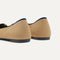 Close up of the heel of The Ballet Flat in Beige and Black, with Rothy's signature blue halo.