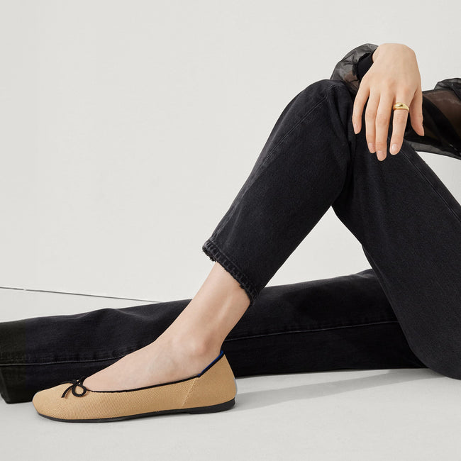 hover | Model wearing The Ballet Flat in Beige and Black.