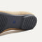 The sole of The Ballet Flat in Beige and Black shown in diagonal view.