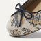 Close up of the rounded toe and bow detail of The Ballet Flat in Bouquet.