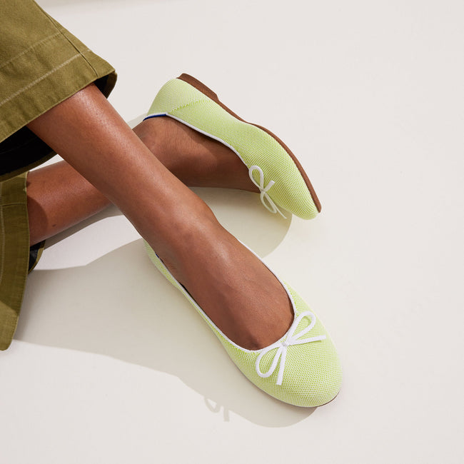 Model wearing The Ballet Flat in Chartreuse. 