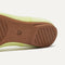 The sole of The Ballet Flat in Chartreuse shown in diagonal view. 