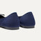 Close up of the heel of The Ballet Flat in Dark Navy, with Rothy's signature blue halo. 