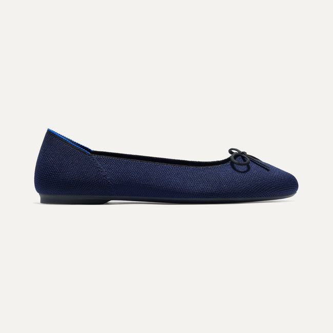 The Ballet Flat in Dark Navy shown from the side. 