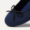Close up of the rounded toe and bow detail of The Ballet Flat in Dark Navy.