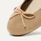 Close up of the rounded toe and bow detail of The Ballet Flat in Goldstone.