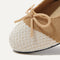 Close up of the rounded toe and bow detail of The Ballet Flat in Pearl.
