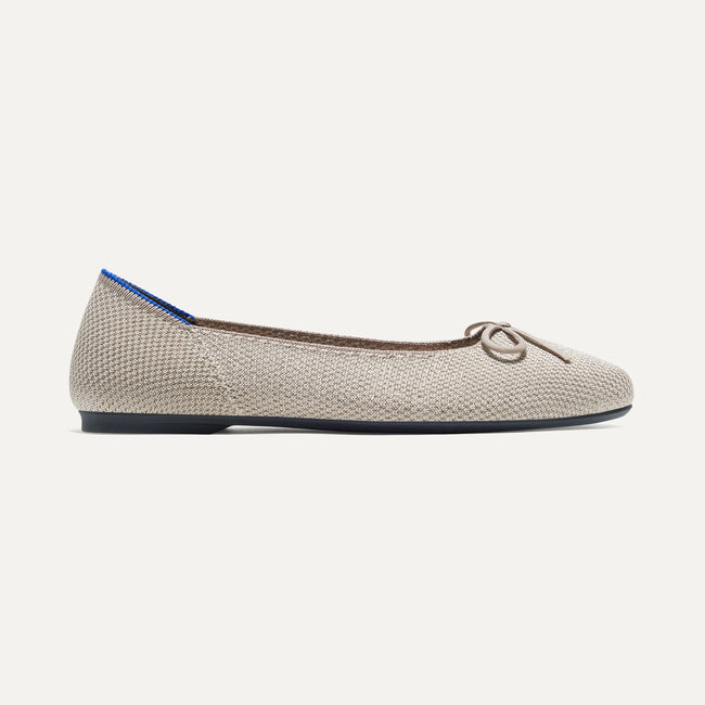 The Ballet Flat in Platinum Metallic shown from the side. 