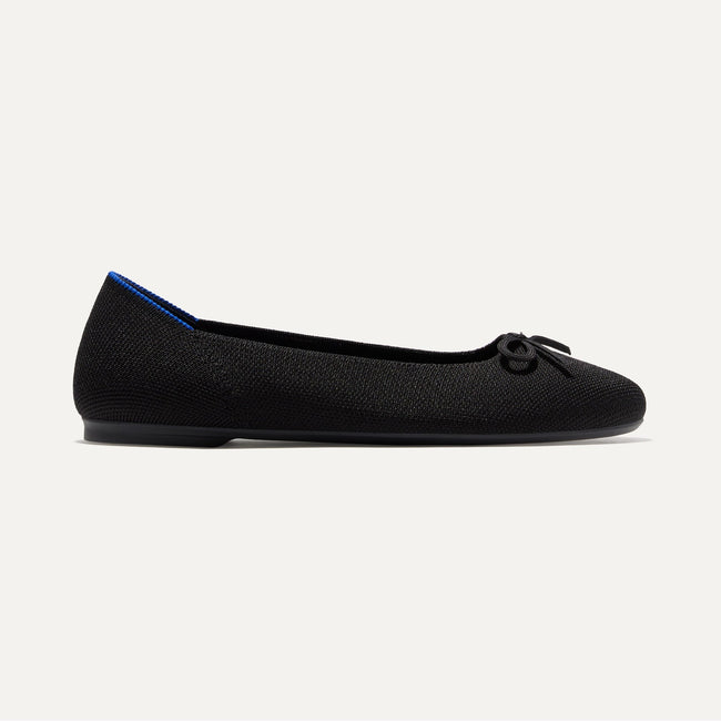 The Ballet Flat in Black shown from the side. 