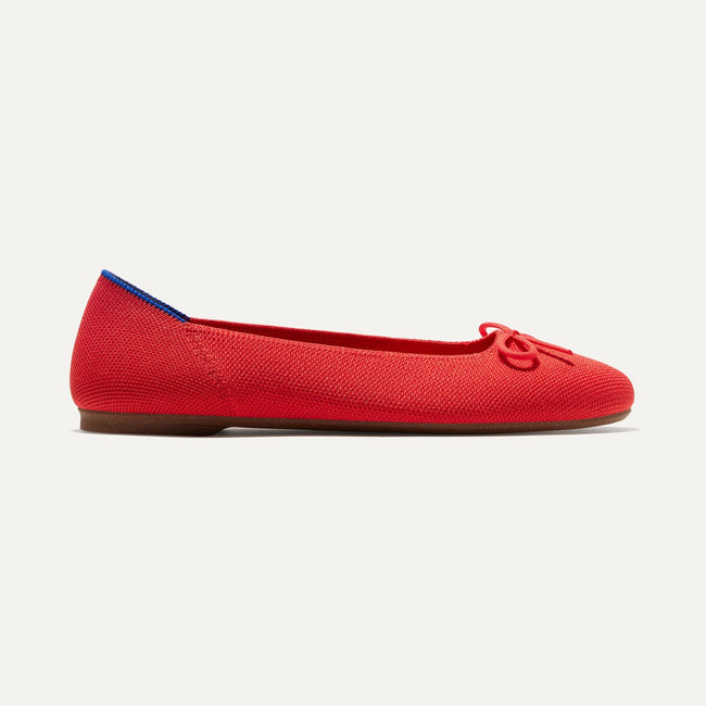 The Ballet Flat in Glamour Red shown from the side. 