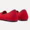 Close up of the heel of The Lounge Loafer in Bombshell Red, with Rothy's signature blue halo. 
