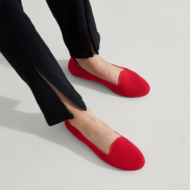 Model wearing The Lounge Loafer in Bombshell Red.