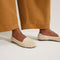 hover | Model wearing The Lounge Loafer in Sandstone.