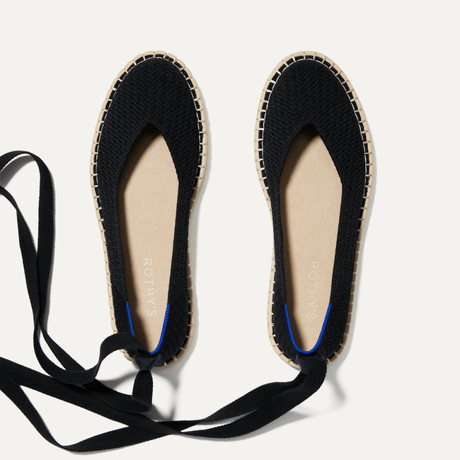 The Espadrille in Black shown from the top, with the ankle tie. 