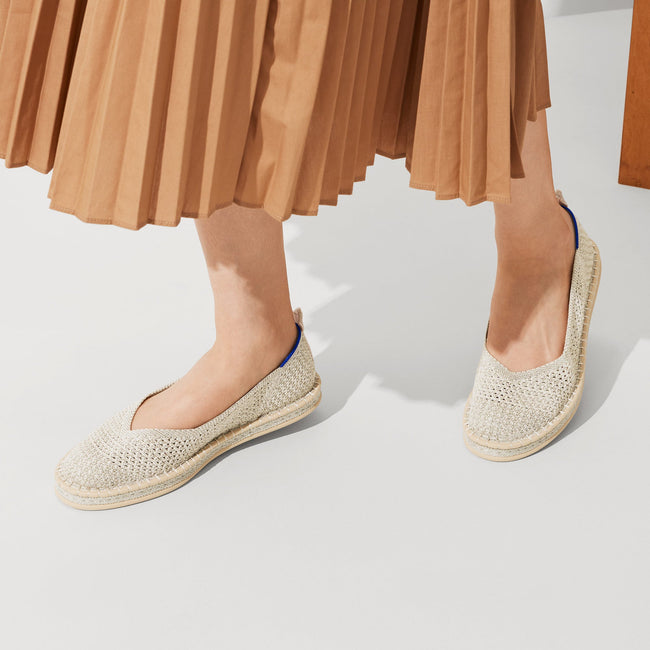 Alternate, close up view of a model wearing The Espadrille in Diamond Metallic.