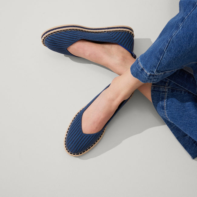 Alternate, close up view of a model wearing The Espadrille in Navy Stripe. 