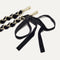 A close-up of The Shoulder Strap in Velvet Black Chain, focusing on the end snap hooks. 