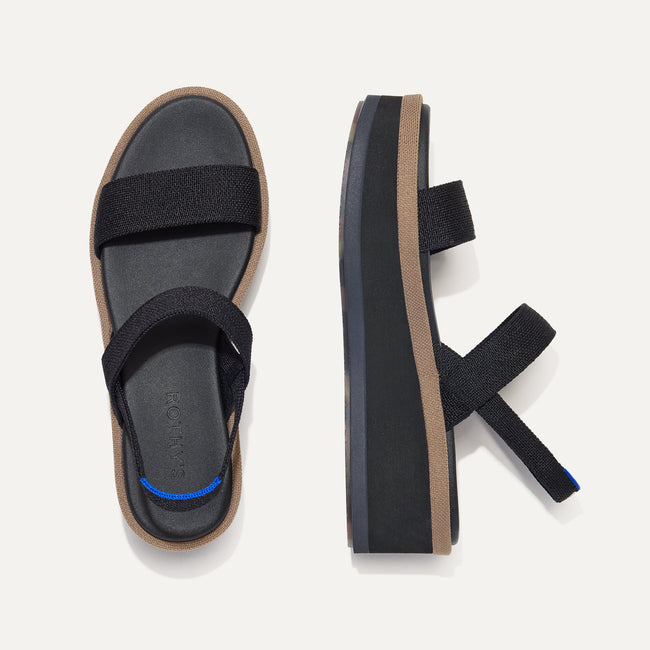 The Lightweight Wedge Sandal in Pepper shown from the top, with one shoe turned on its side.