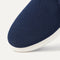 The toe and vamp of The Ravello Slip On Sneaker in Dark Navy, in diagonal view.