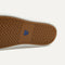Outsole of The Ravello Slip On Sneaker in Wheat shown from below, in diagonal view. 