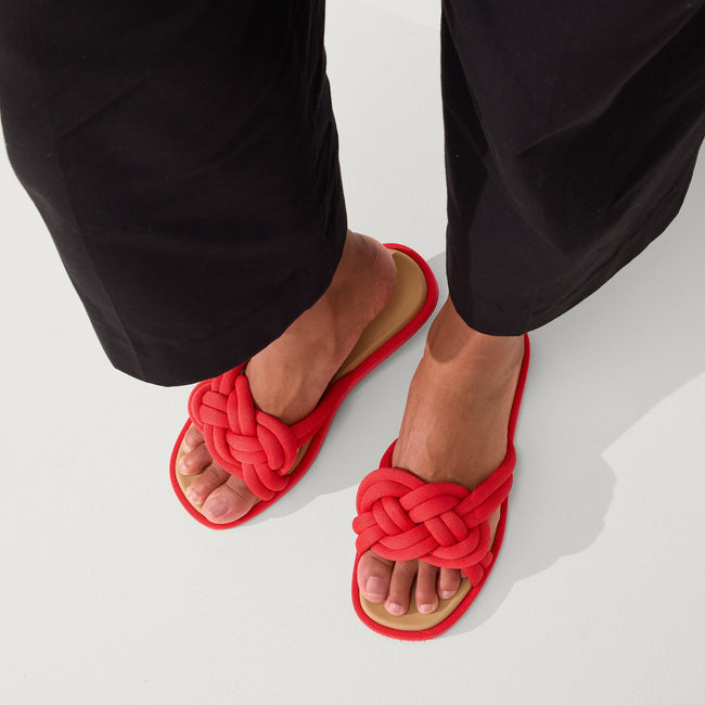 Model wearing The Summer Sandal in Red Hot. 