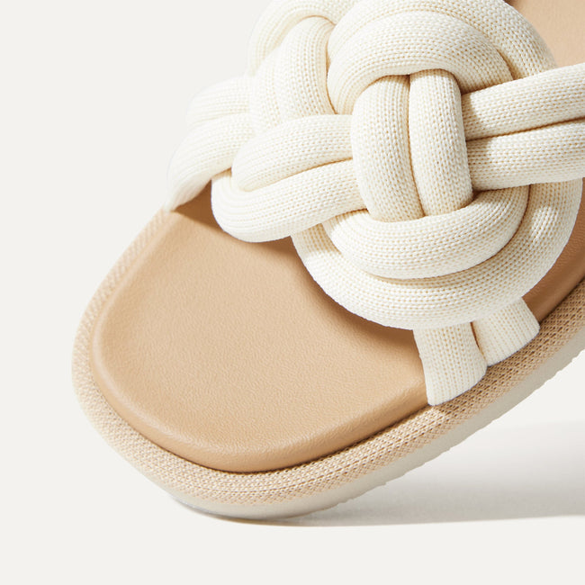 Close up of the vamp of The Summer Sandal in White Sand. 