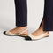 hover | Model wearing The Almond Slingback in Conch Captoe.