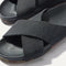 Close up of the crossing knit straps and toe of The Weekend Slide in Black, shown in diagonal view. 