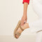 hover | Model wearing The Lightweight Wedge Sandal in Beach Sand Woven.