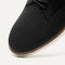 The toe and vamp of The Oxford in Black, in diagonal view.