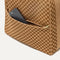 The front pocket of The Backpack in Hazelnut.