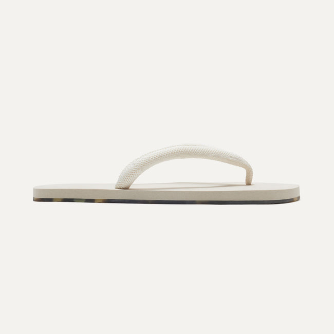 The Flip Flop in White Sand shown from a side view showing the outsole.