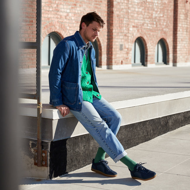 Alternate view of a model wearing The RS01 Sneaker in Navy.