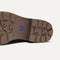 Close up of the outsoles of The Cozy Laced Lug Boot in Sparrow, with raised grooves for added traction. 