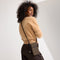 An alternate view of a model wearing The Phone Crossbody in Midnight Song. 