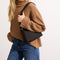 hover | The Casual Crossbody in Night Song, worn over the shoulder by a model, shown from the side. 