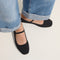 hover | Model wearing The Max Square Mary Jane in Black Sand.